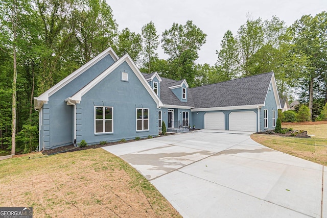 view of front facade featuring a garage and a front lawn