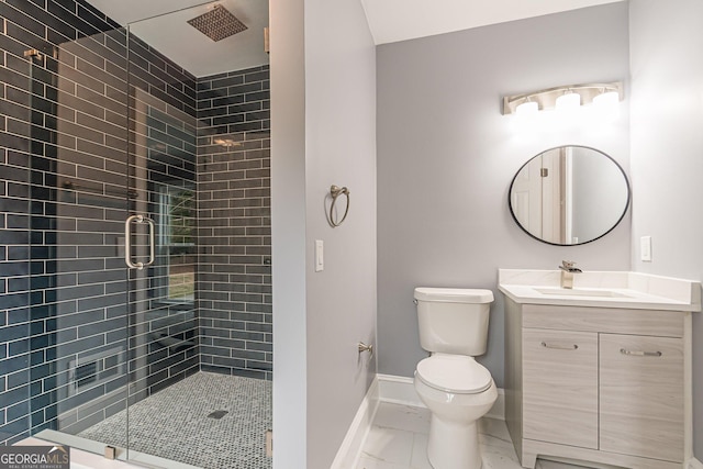 bathroom with toilet, vanity, and walk in shower