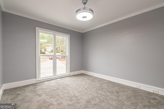 unfurnished room with carpet and ornamental molding