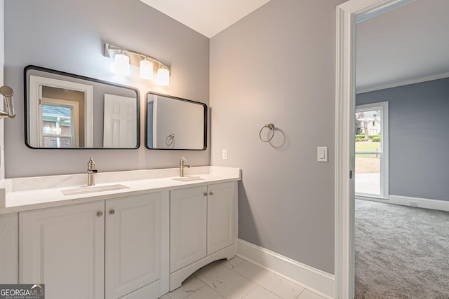 bathroom with vanity and crown molding