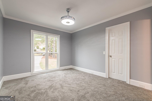 carpeted empty room with ornamental molding