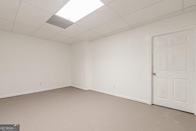 unfurnished room with a paneled ceiling