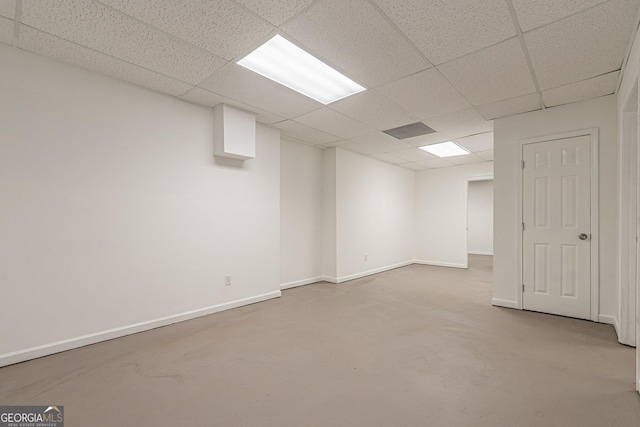 basement featuring a paneled ceiling