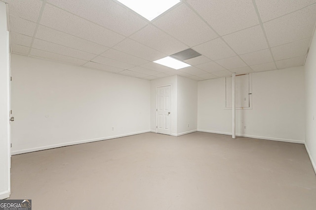 basement featuring a paneled ceiling