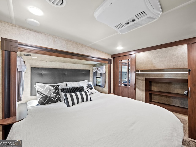 bedroom featuring wooden walls