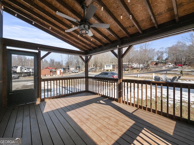 wooden deck featuring ceiling fan