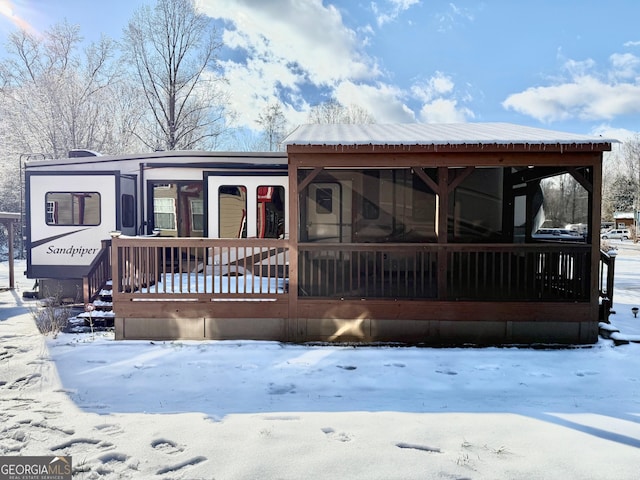 view of front of house with a sunroom