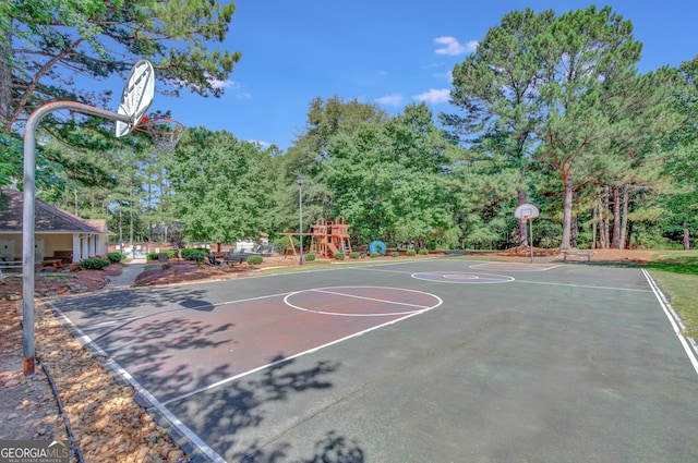 view of sport court featuring a playground