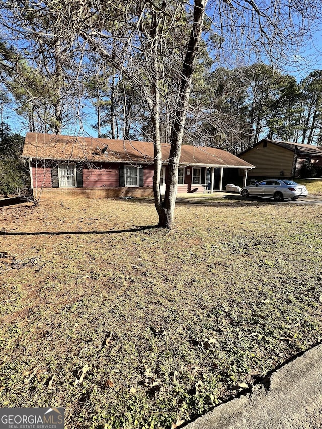 ranch-style house with a carport