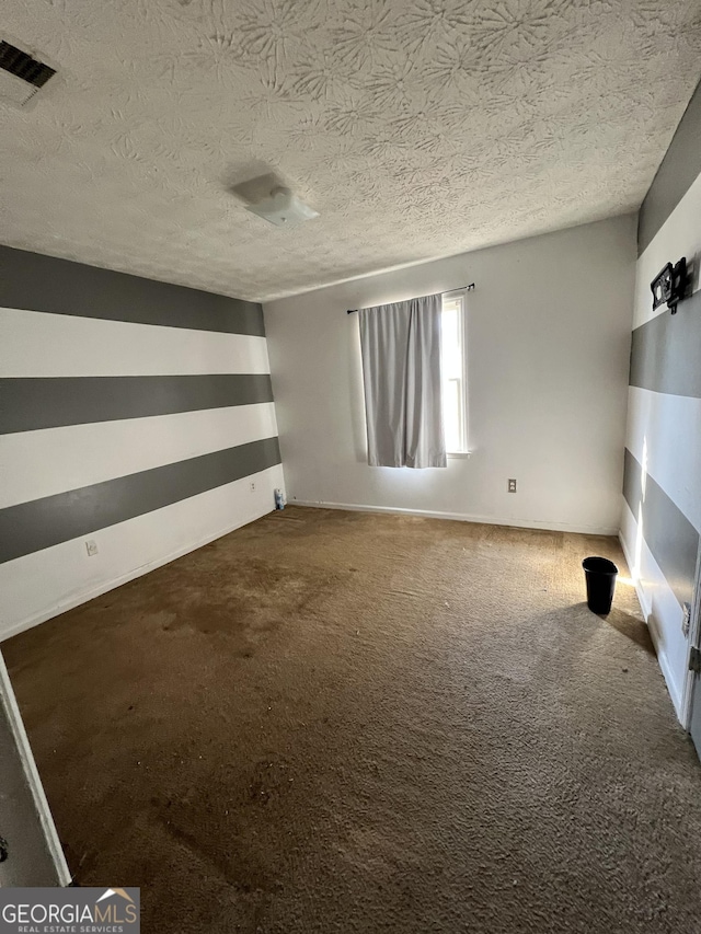 interior space with a textured ceiling