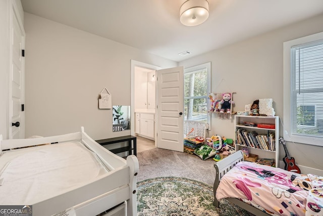 carpeted bedroom with ensuite bathroom