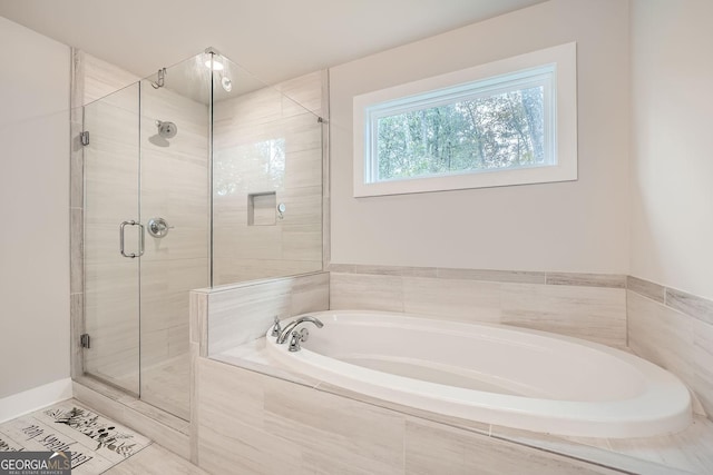 bathroom featuring separate shower and tub and tile patterned floors