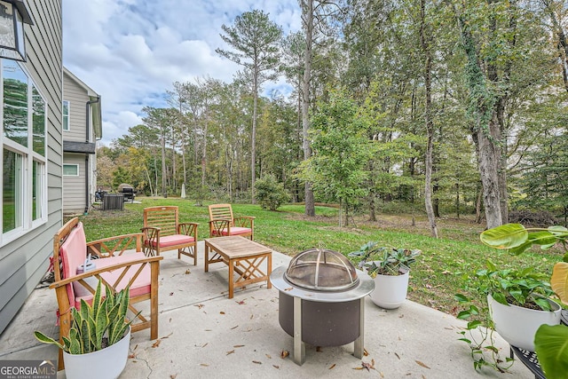 view of patio / terrace with a fire pit