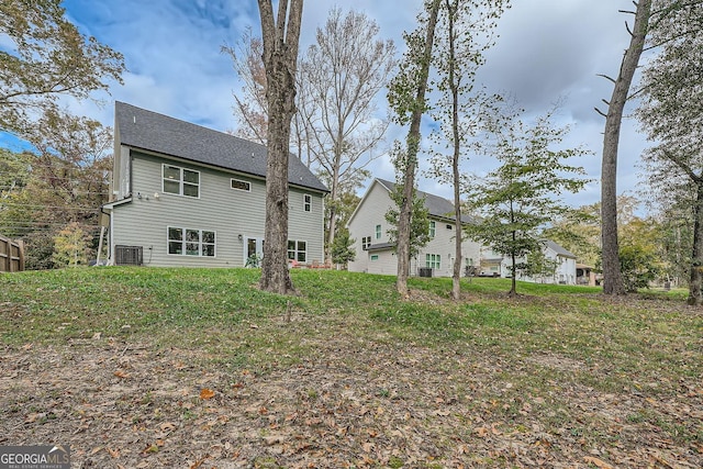 back of property featuring central air condition unit