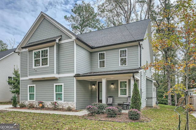 view of front of home with a front lawn and a porch