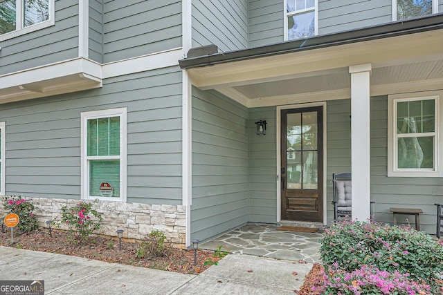 entrance to property with a porch