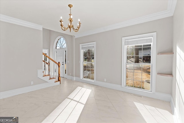 interior space featuring an inviting chandelier and crown molding