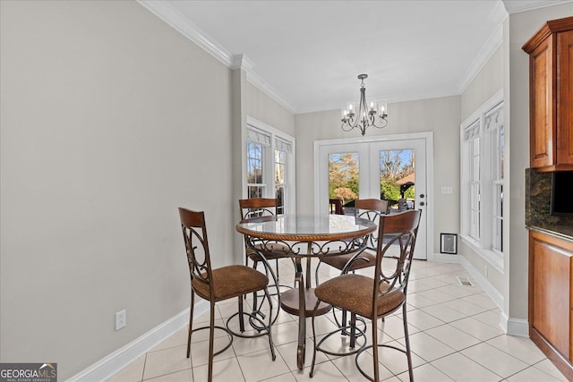 dining space featuring crown molding, french doors, light tile patterned flooring, and an inviting chandelier