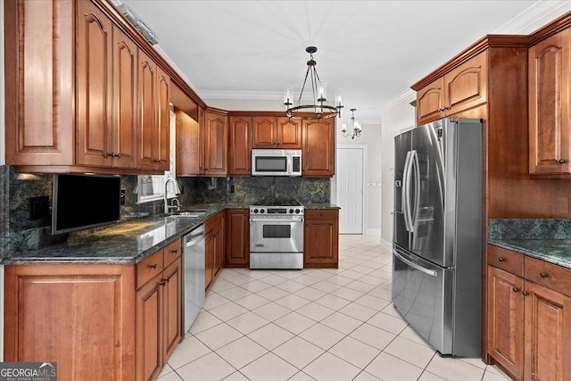 kitchen with a notable chandelier, backsplash, crown molding, decorative light fixtures, and appliances with stainless steel finishes