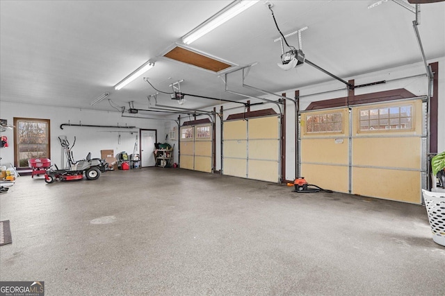 garage featuring a garage door opener