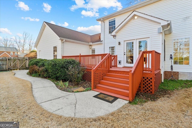 back of property featuring a wooden deck