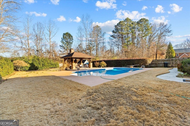 view of swimming pool with a gazebo, a yard, a patio, and a diving board