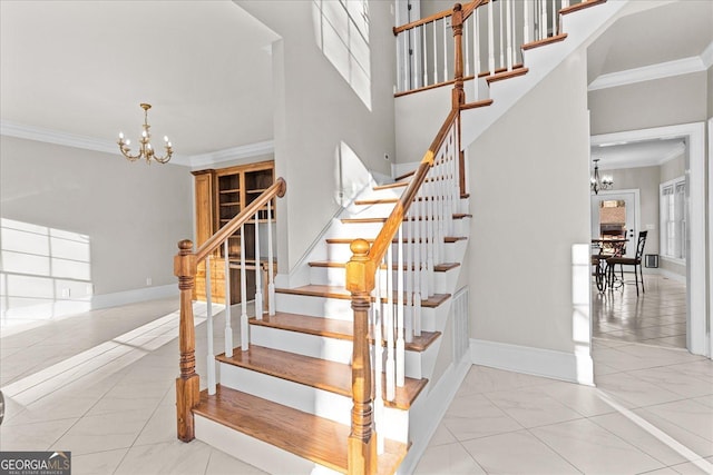 stairs featuring ornamental molding and a notable chandelier