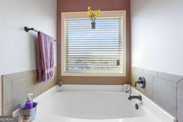 bathroom featuring a washtub