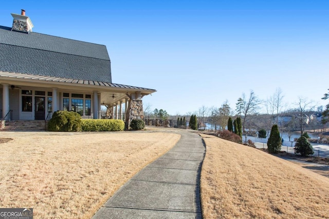 view of home's community with a lawn