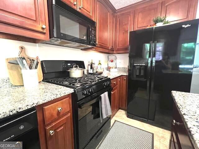 213 Moore Valley Way, Canton, GA 30115 - kitchen featuring black appliances and light stone countertops