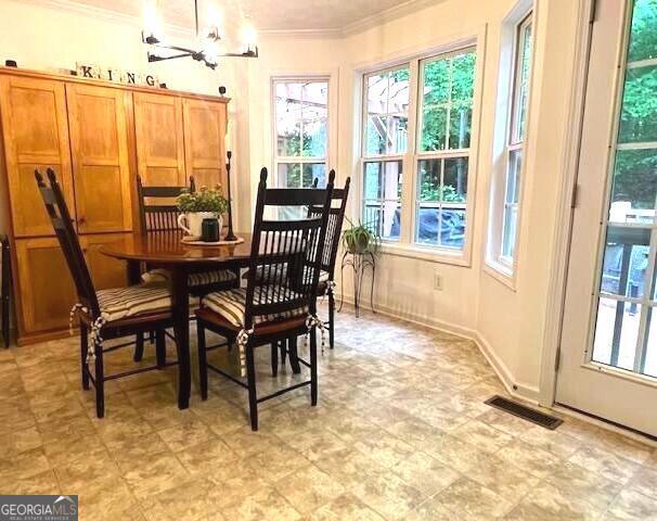 213 Moore Valley Way, Canton, GA 30115 - dining area with crown molding and plenty of natural light