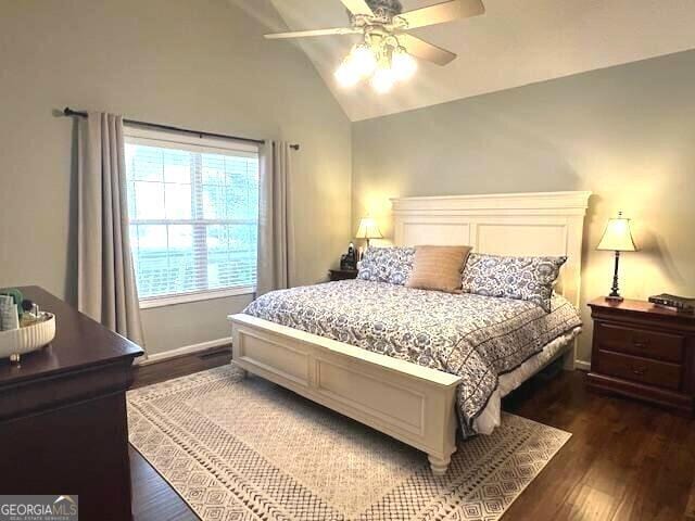 213 Moore Valley Way, Canton, GA 30115 - bedroom with lofted ceiling, dark wood-style flooring, and a ceiling fan