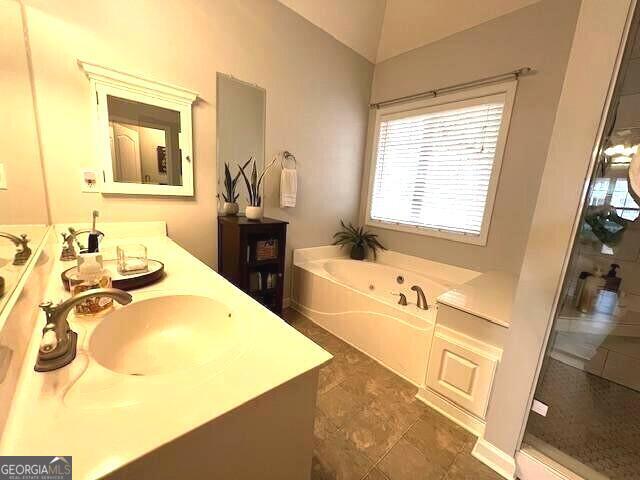 213 Moore Valley Way, Canton, GA 30115 - bathroom with double vanity, a garden tub, and an enclosed shower