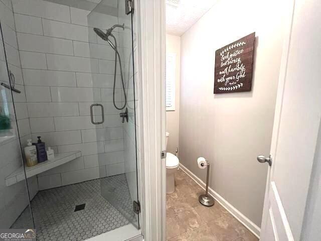 213 Moore Valley Way, Canton, GA 30115 - full bath featuring toilet, a stall shower, and baseboards