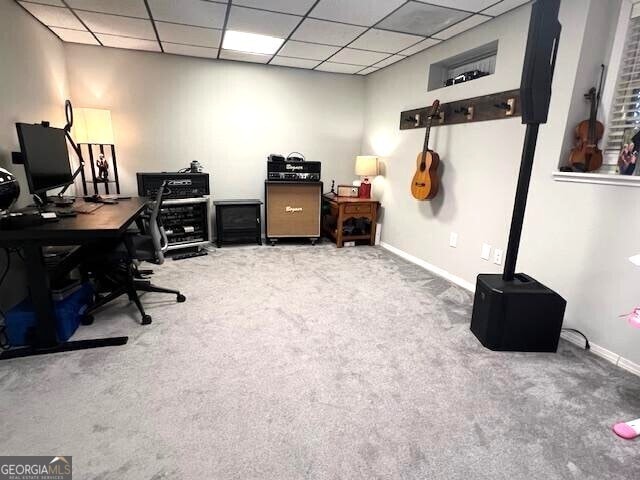 carpeted office featuring a drop ceiling