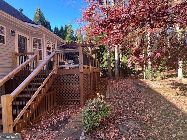 view of yard featuring a pergola and a deck