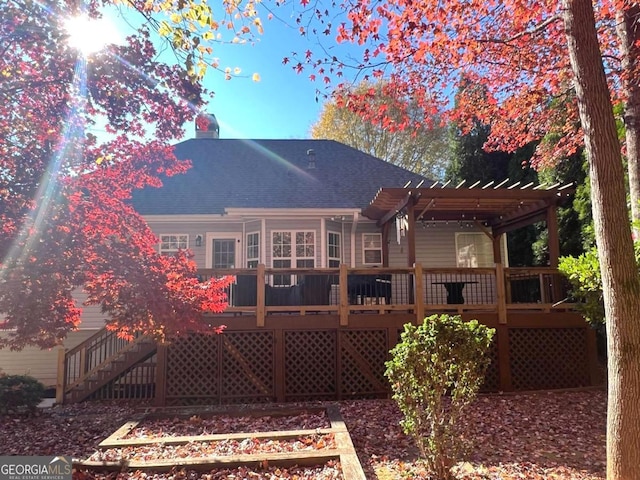 213 Moore Valley Way, Canton, GA 30115 - back of house featuring a shingled roof, a deck, a pergola, and a garden