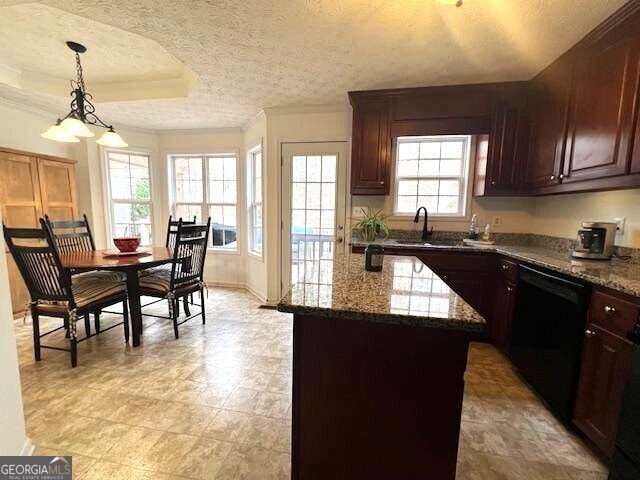 kitchen with sink, dark stone countertops, a center island, black dishwasher, and decorative light fixtures