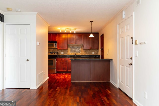 kitchen with ornamental molding, tasteful backsplash, hanging light fixtures, and appliances with stainless steel finishes