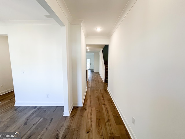 corridor featuring crown molding and hardwood / wood-style floors