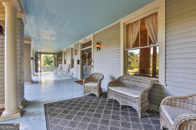 view of patio featuring a porch