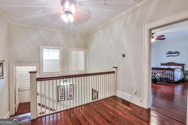 hall featuring ornamental molding and dark wood-type flooring