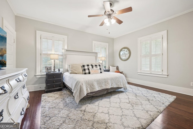 bedroom with ceiling fan, dark hardwood / wood-style floors, and crown molding