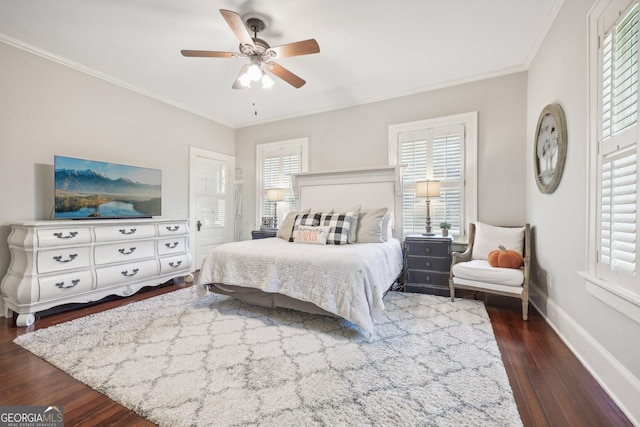 bedroom featuring ceiling fan, dark hardwood / wood-style flooring, and ornamental molding