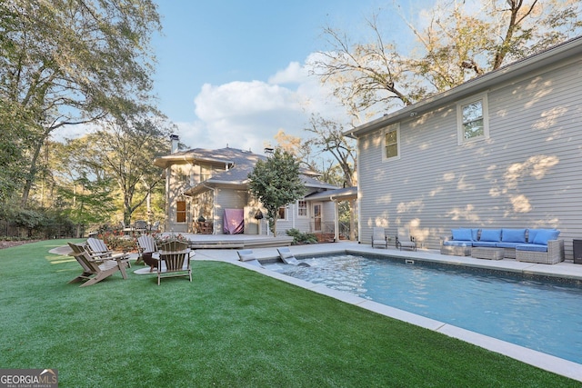 view of pool with a yard and an outdoor hangout area