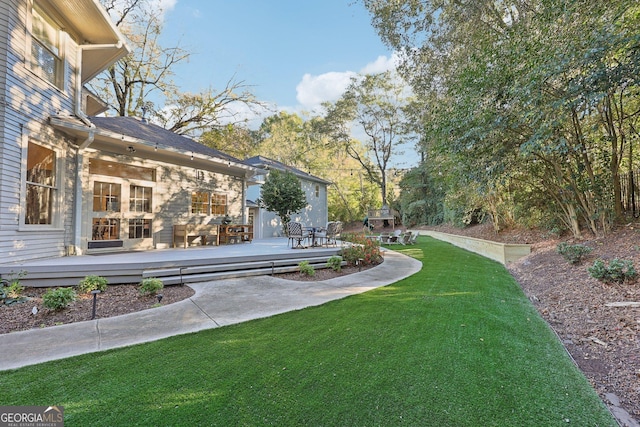 view of yard with a wooden deck