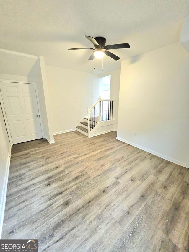 interior space featuring light hardwood / wood-style floors and ceiling fan