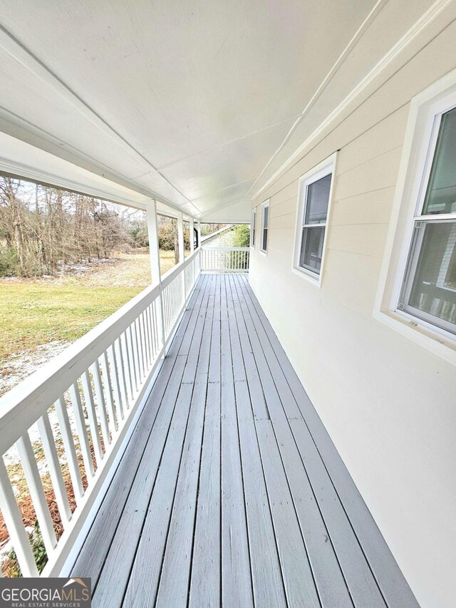 wooden terrace with a porch