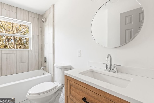 full bathroom with vanity, toilet, and tiled shower / bath combo