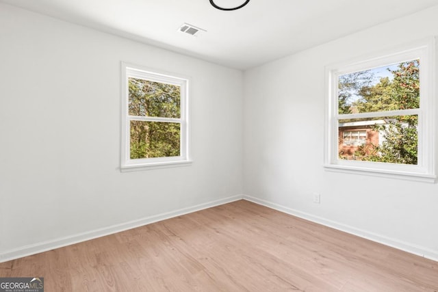 spare room with light wood-type flooring